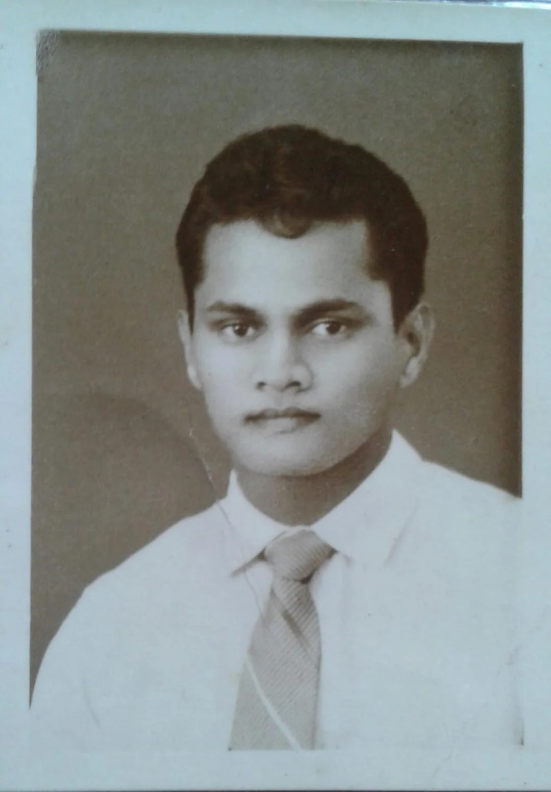 Portrait photo of a young Quintus Andradi soon after sitting for his S.S.C. exam.